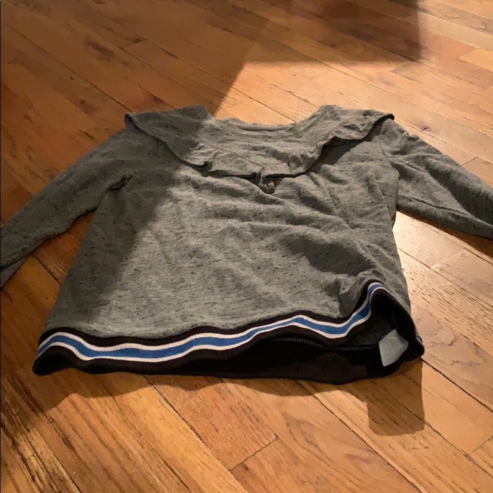 Grey long sleeve with black, white, blue stripes
